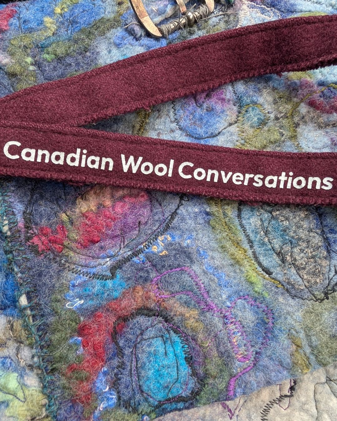 Canadian Wool Conversations banner over colourful felted wool